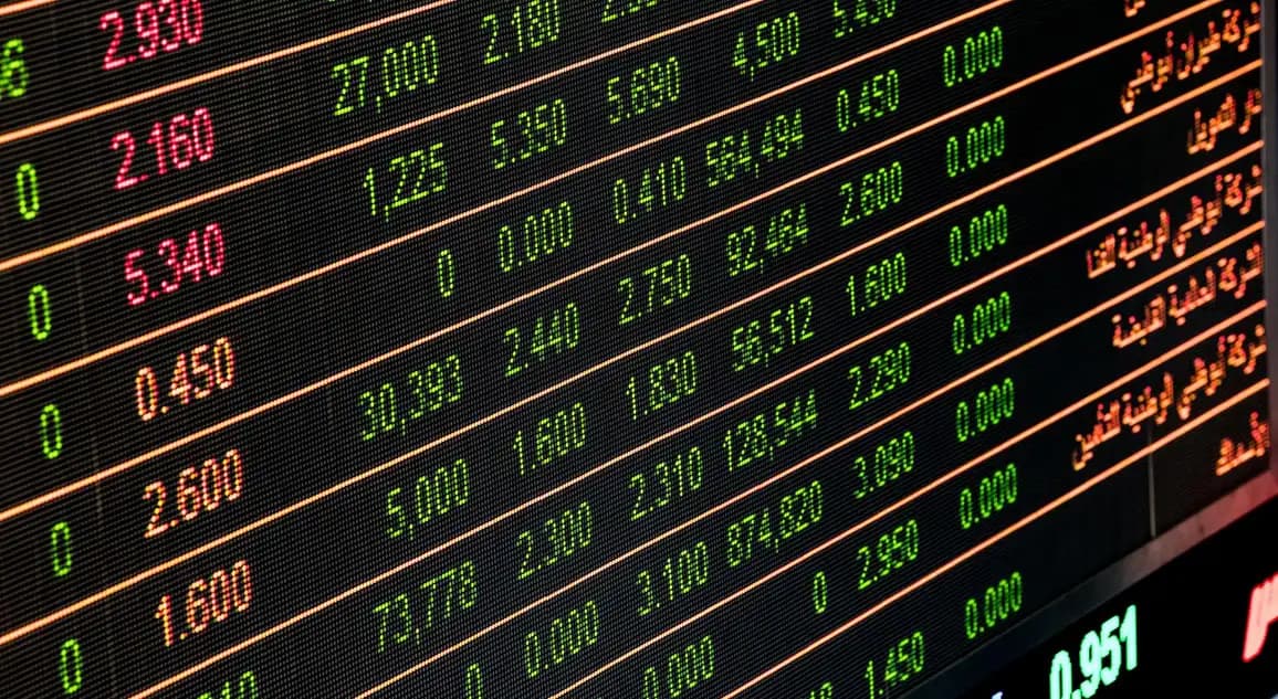A monitor filled with share price figures